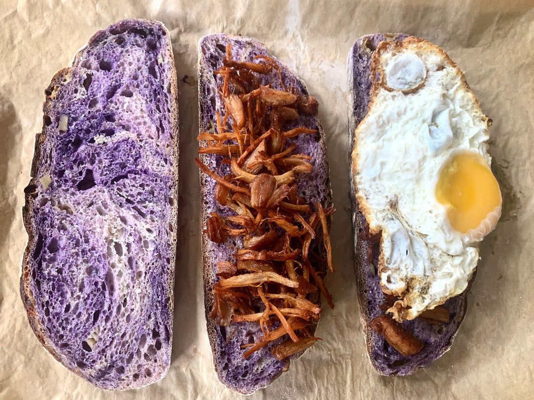 Artisanal ube queso sourdough from Rise Artisanal in Manila — bread with ube jam and cheese bits paired with Pinoy-style adobo flakes and fried egg.
